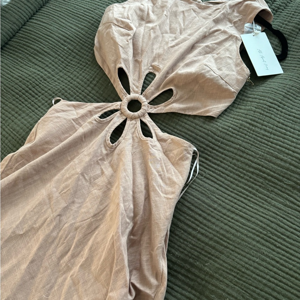 Brand new dress from Jean Jail. Perfect for summertime. Size 4